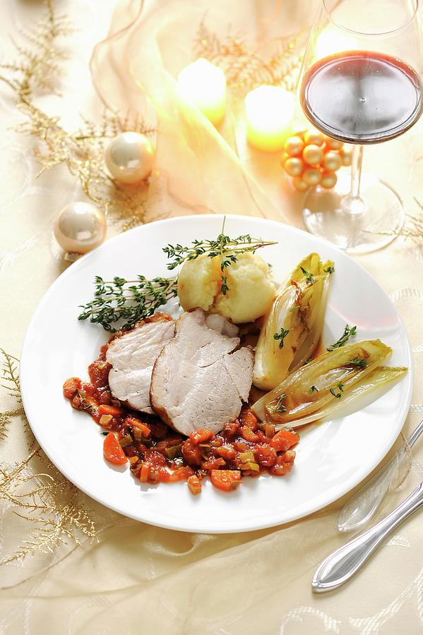 Roast Pork With Chicory And Potato Dumplings For Christmas Photograph by Antje Plewinski