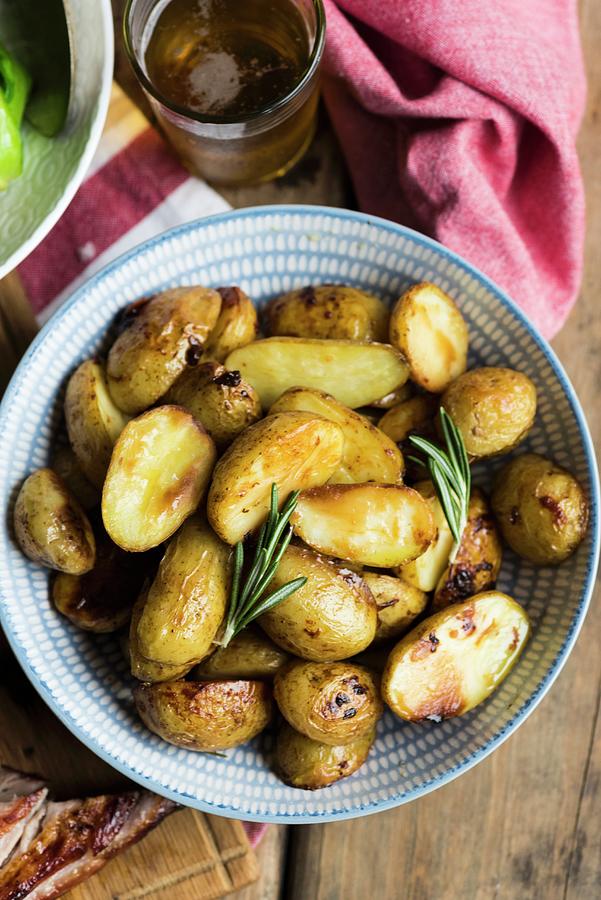 Roast Potatoes With Rosemary seen From Above Photograph by Hein Van Tonder