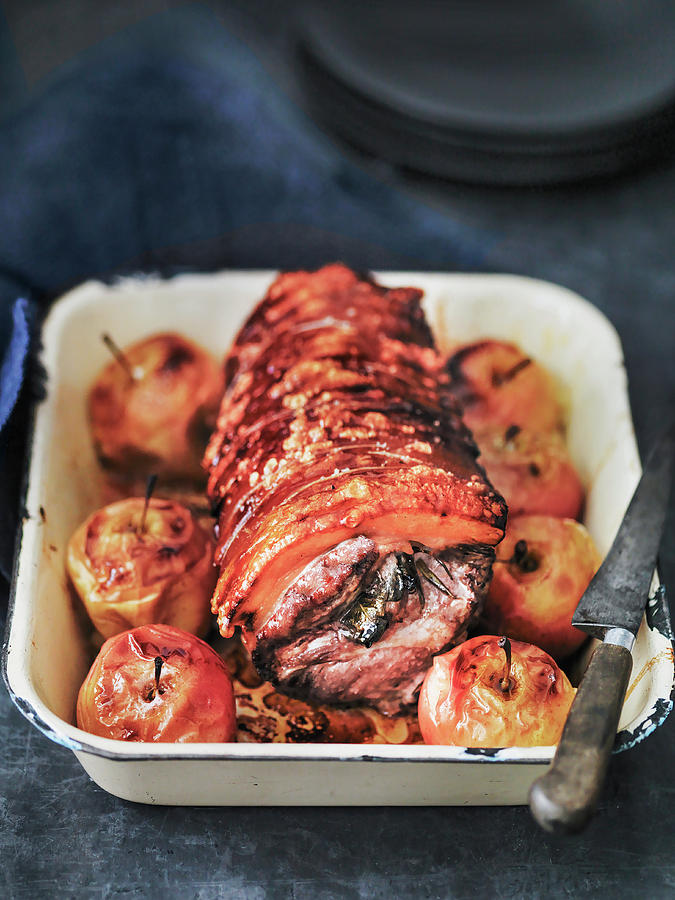 Roast Rolled Joint Of Pork Stuffed With Rosemary, Sage And Apples Photograph by Michael Paul