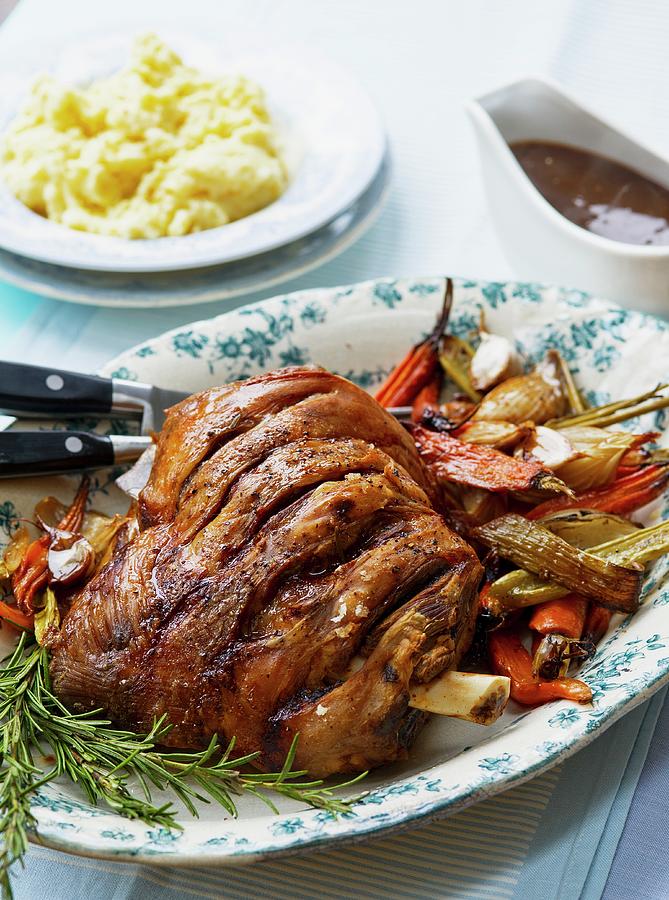 Roast Shoulder Of Lamb With Vegetables Rosemary Mashed Potatoes And Gravy Photograph By Tim