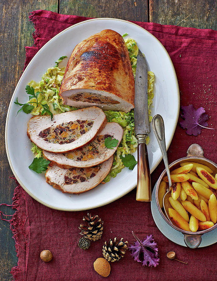 Roast Turkey Stuffed With Baked Fruits On A Bed Of Savoy Cabbage Photograph by Jalag / Julia Hoersch