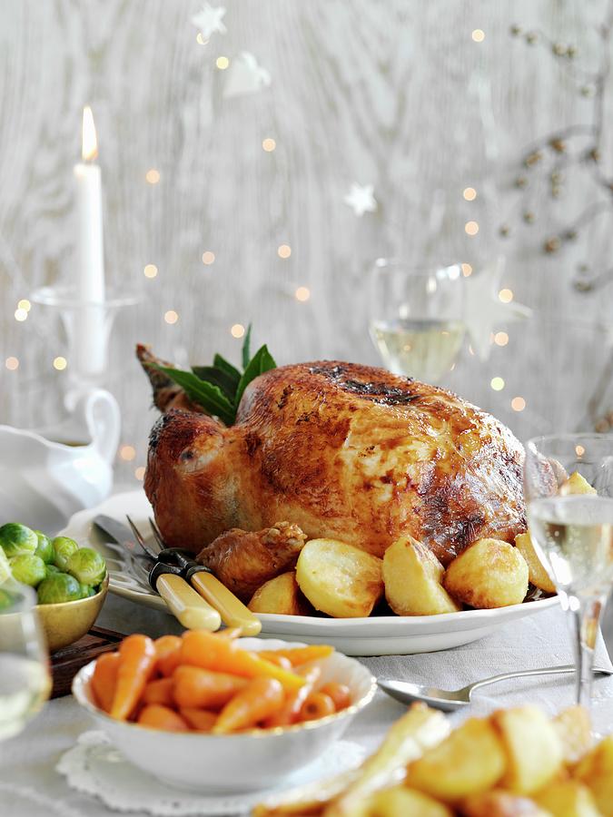 Roast Turkey With Potatoes And Carrots For Christmas Photograph by Gareth Morgans
