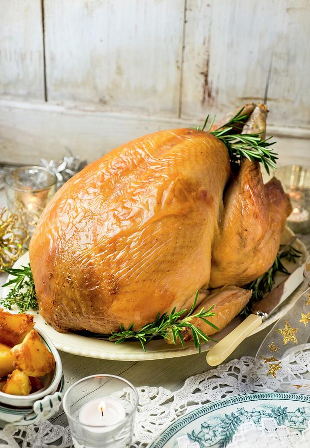 Roast Turkey With Rosemary For Christmas Dinner Photograph by Jonathan Short