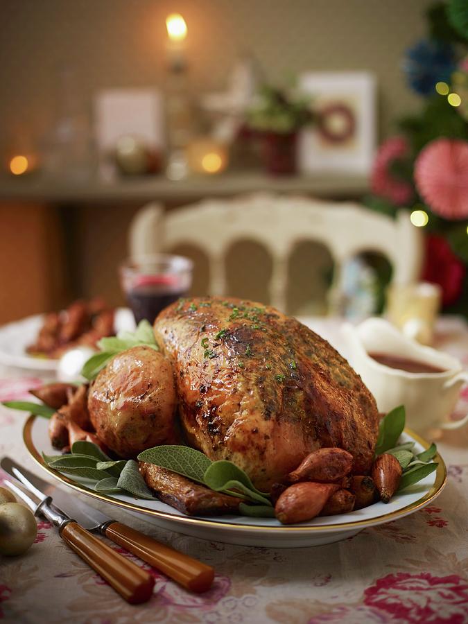 Roast Turkey With Shallots And Sage For Christmas Photograph by Myles New