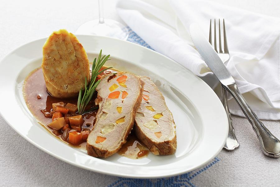 Roast Veal Studded With Vegetables Served With Dumplings Photograph by Herbert Lehmann