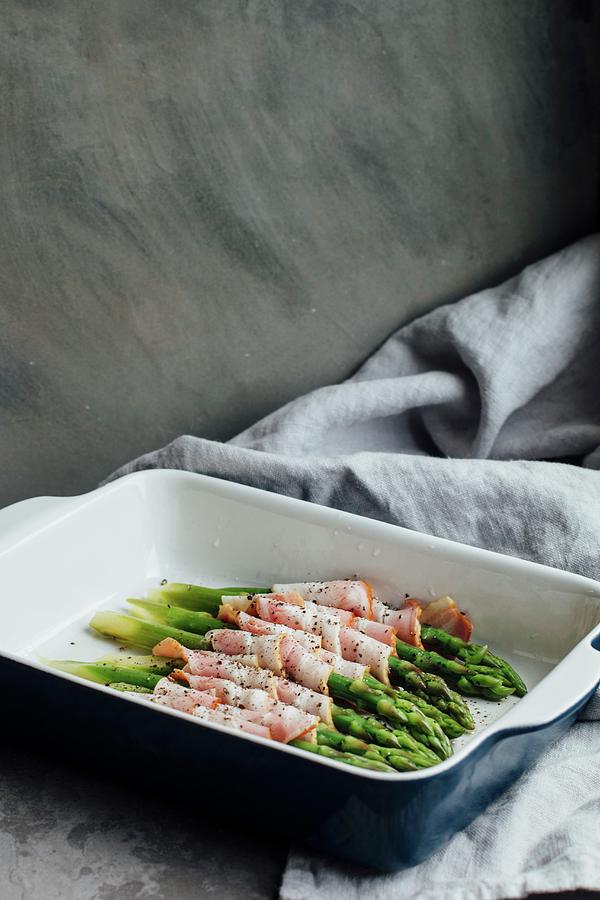 Roasted Asparagus Wrapped In Bacon Photograph by Kate Prihodko