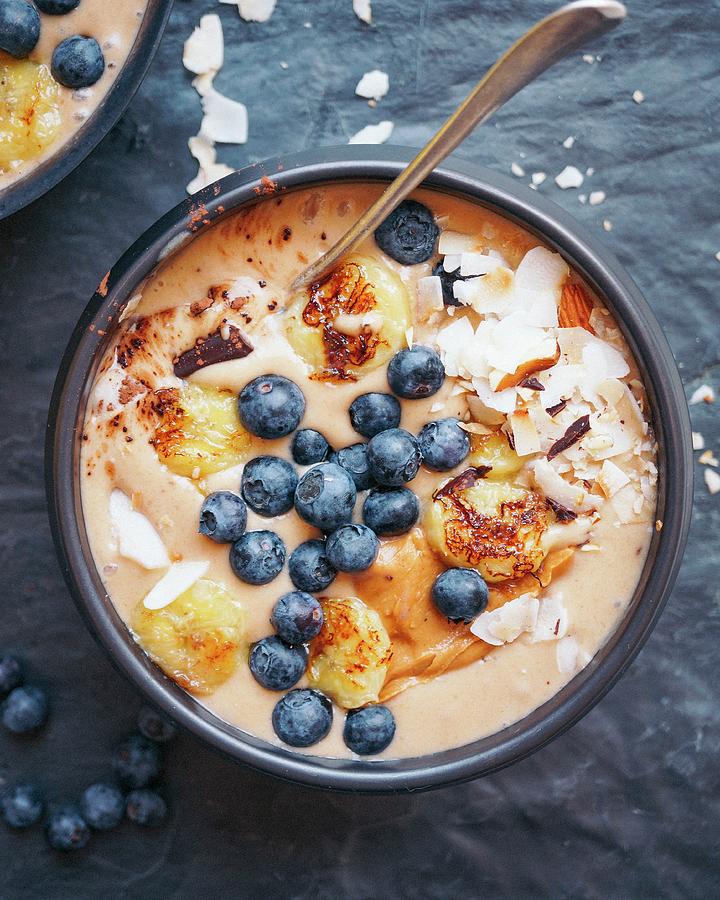 Roasted Banana Smoothie, Chocolate, Coconut With Peanut Butter And Blueberries Photograph by Velsberg