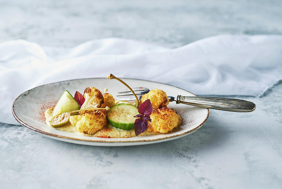 Roasted Cauliflower With Cauliflower Almond Puree With Pickled Cucumber, Apple Capers, Spring Onions And Red Cress Photograph by Arjan Smalen Photography