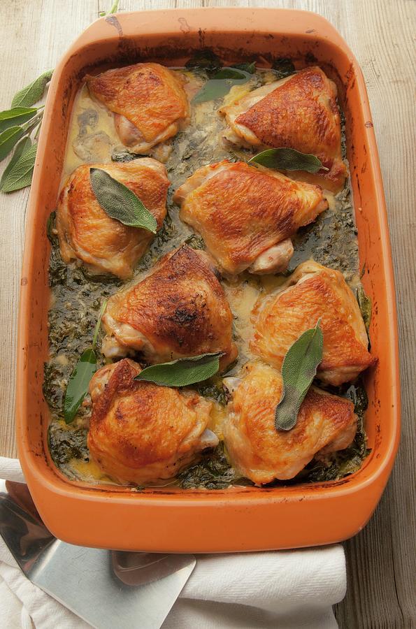 Roasted Chicken Thighs In A Creamy Kale Sauce Photograph by William Boch