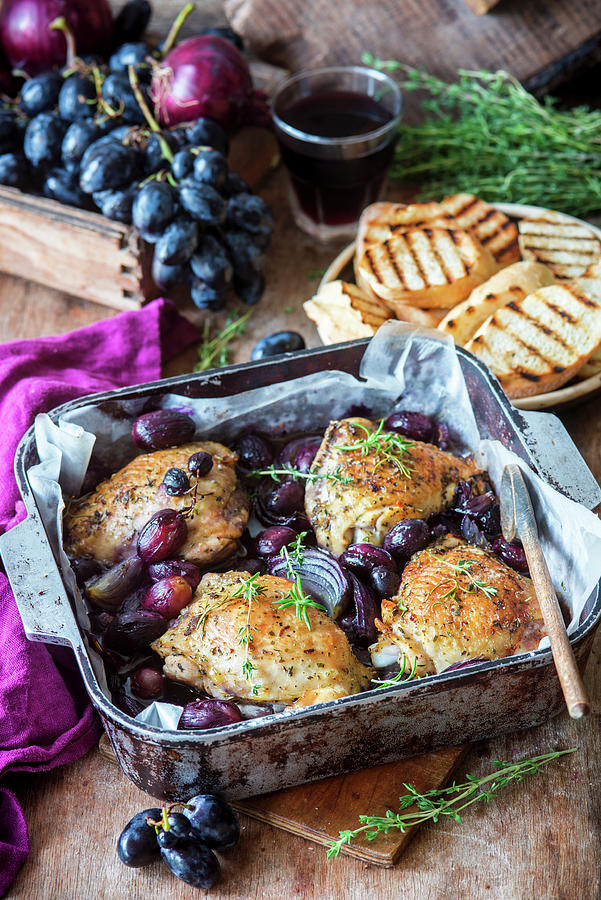 Roasted Chicken Thighs With Grapes And Thyme In A Roasting Pan Photograph by Irina Meliukh