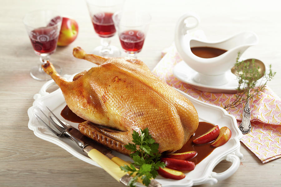 Roasted Goose For Christmas Dinner Filled With Apple Stuffed And Served With Apple Wedges Photograph by Teubner Foodfoto
