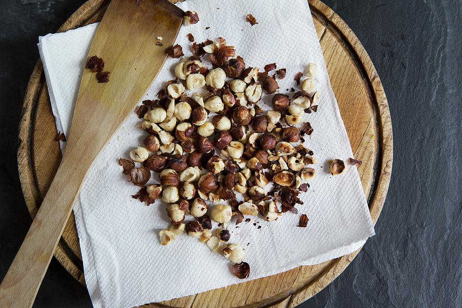 Roasted Hazelnuts On A Piece Of Kitchen Paper seen From Above Photograph by Cath Lowe