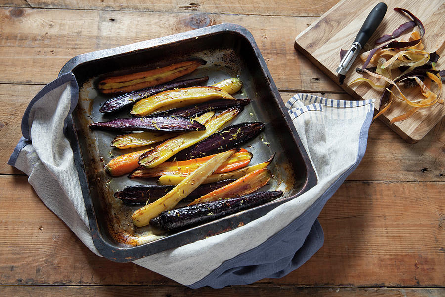 Roasted Heritage Carrots With Lemon And Cumin In A Baking Tray Photograph by Andr Ainsworth