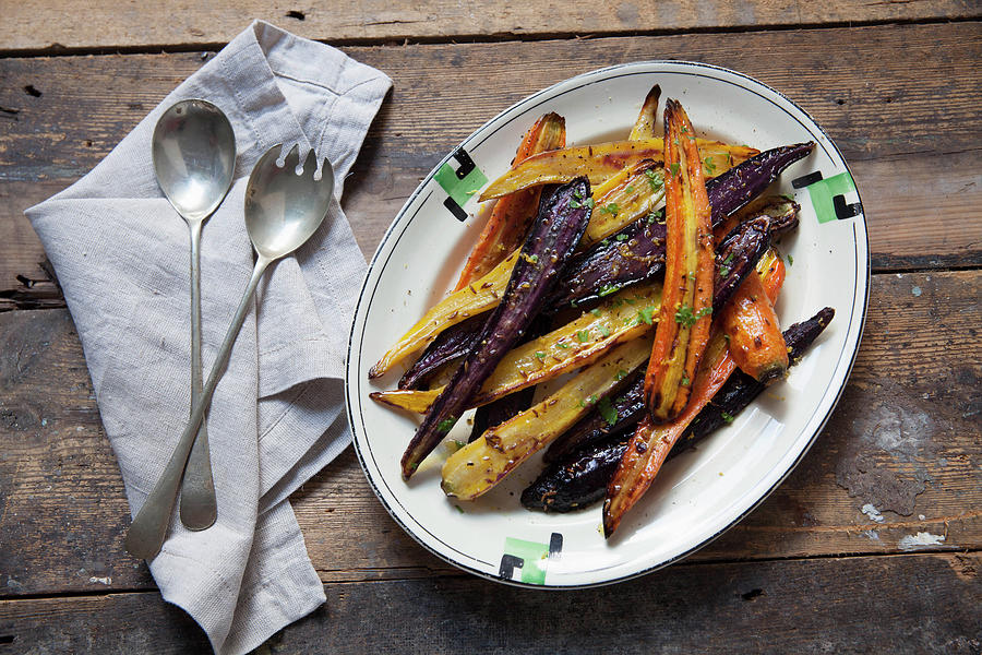 Roasted Heritage Carrots-with Lemon And Cumin On A Plate Photograph by Andr Ainsworth