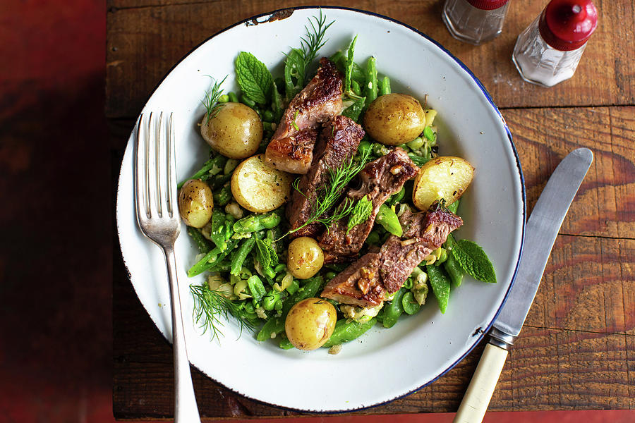 Roasted Lamb On A Bean Salad With New Potatoes Photograph by Lara Jane Thorpe