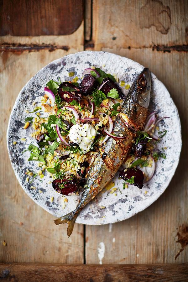 Roasted Mackerel On Bulgur With Beetroot And Onion seen From Above