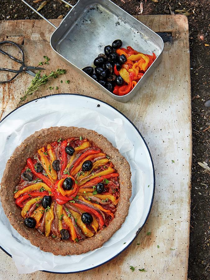 Roasted Pepper And Olive Tart With Anchovies Photograph by Lukejalbert