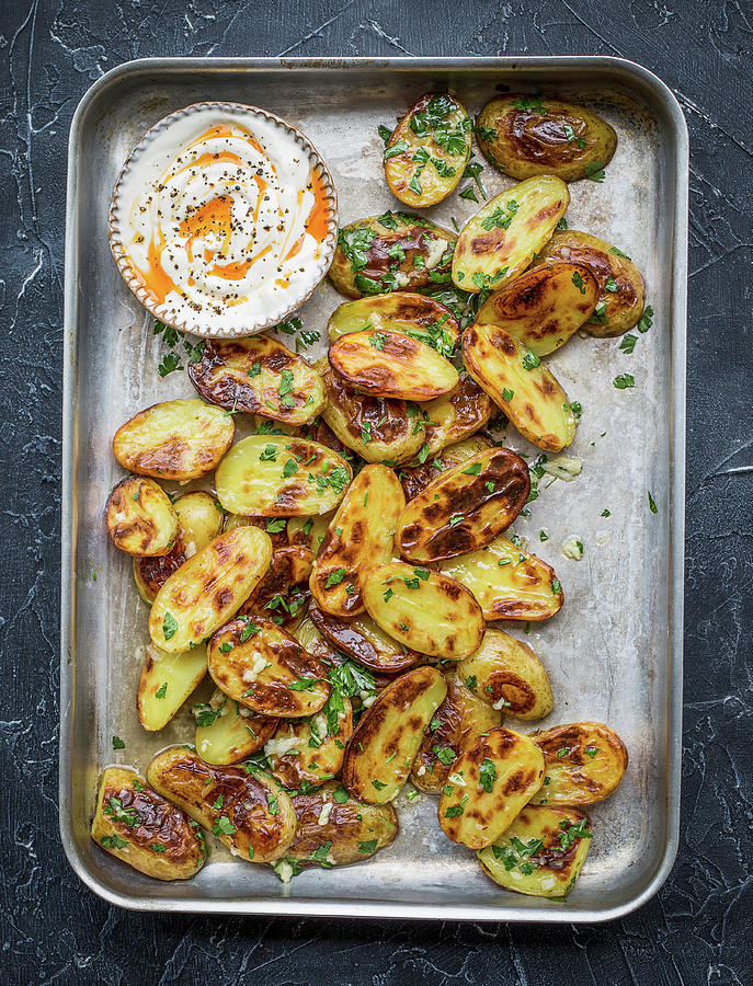 Roasted Potatoes On Baking Tray With Parsley And Garlic Photograph by Anna Jakutajc-wojtalik
