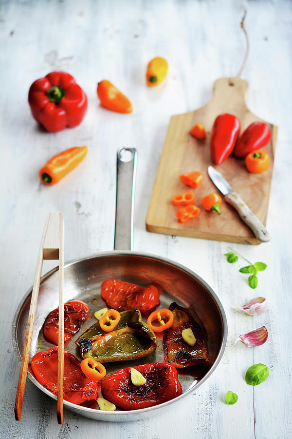 Roasted Red, Yellow And Green Peppers In A Pan Photograph by Mariola Streim