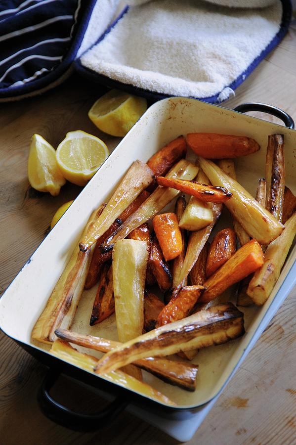 Roasted Root Vegetables In A Roasting Dish Photograph by Bill Kingston