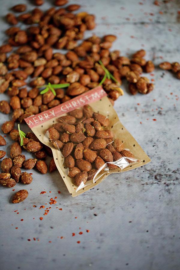 Roasted Rosemary And Chilli Almonds, With Some Packaged Photograph by Tina Engel