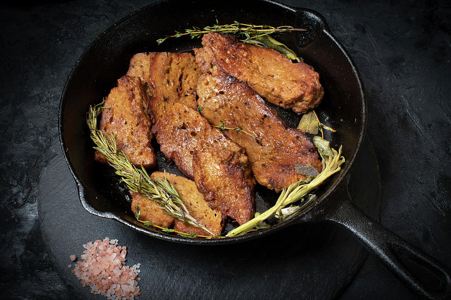 Roasted Seitan In Cast Iron Pan With Various Herbs And Spices Photograph by Adelina