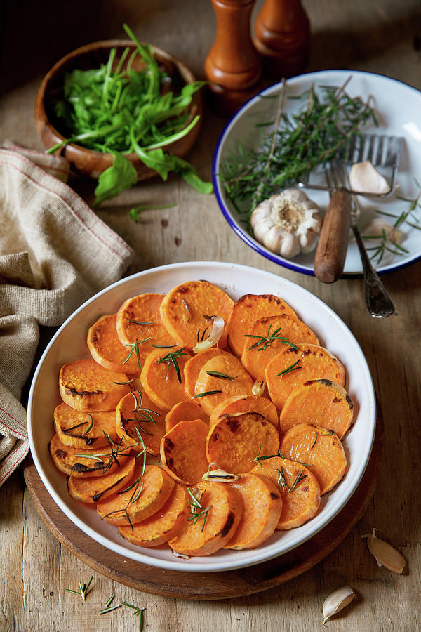 Roasted Slices Of Sweet Potato Served In A Baking Form Photograph by Larisa Slepyan Eshed