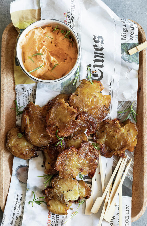 Roasted Smashed Potatoes With A Harissa And Tahini Dip Photograph by Lilia Jankowska