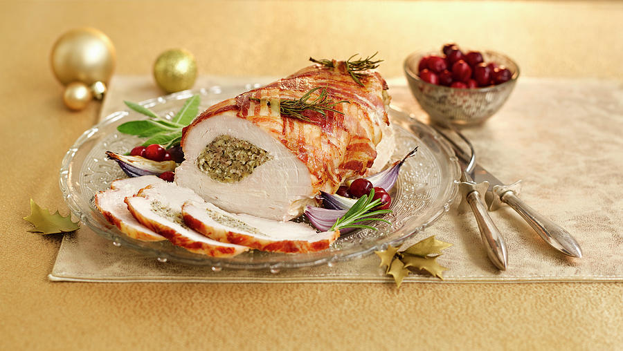 Roasted Turkey Breast With A Pork And Herb Crust Topped With Bacon For Christmas Dinner Photograph by Gareth Morgans