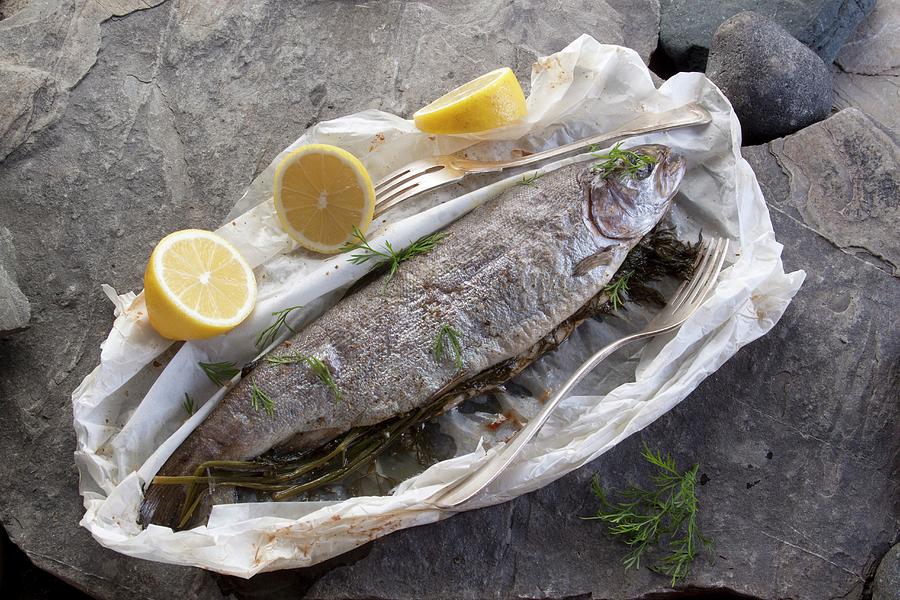 Roasted Whole Trout With Dill And Lemon In Parchment Paper Photograph by Wawrzyniak.asia