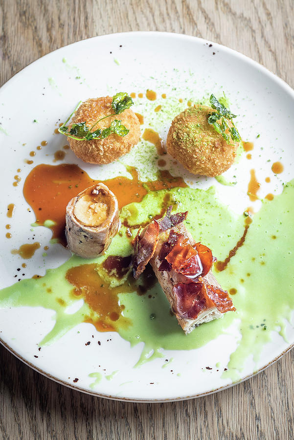 Roasted Wild Rabbit With Crispy Bacon And Stuffed Rice Balls Arancini And A Sweet Green Pea Sauce And Gravy Photograph by Giulia Verdinelli Photography