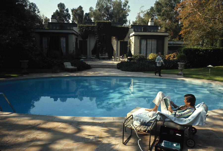 Robert Evans Reads Poolside Photograph by Alfred Eisenstaedt Robert Evans Reads Poolside Photograph by Alfred Eisenstaedt