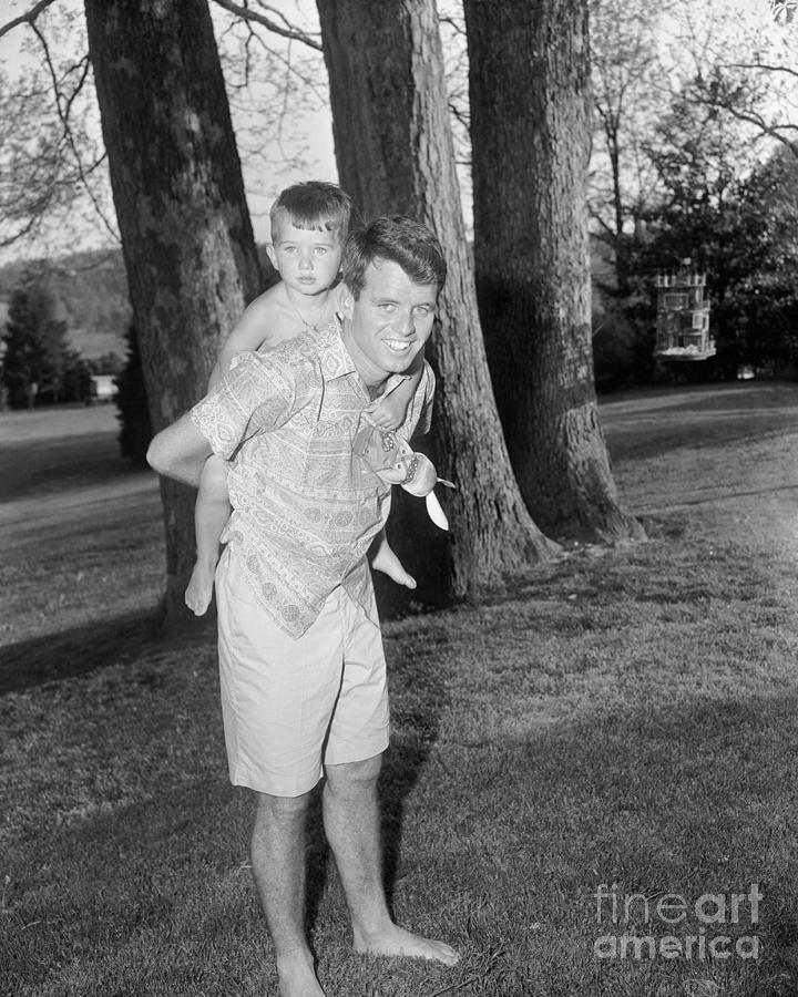 Robert F. Kennedy Carrying Son Robert Photograph by Bettmann