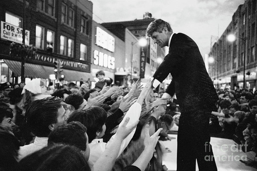 Robert F. Kennedy Shaking Hands Atop Photograph by Bettmann