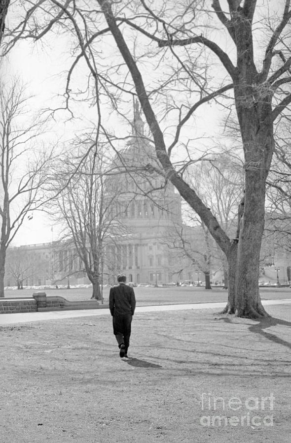 Robert Kennedy Walking Across Lawn Photograph by Bettmann