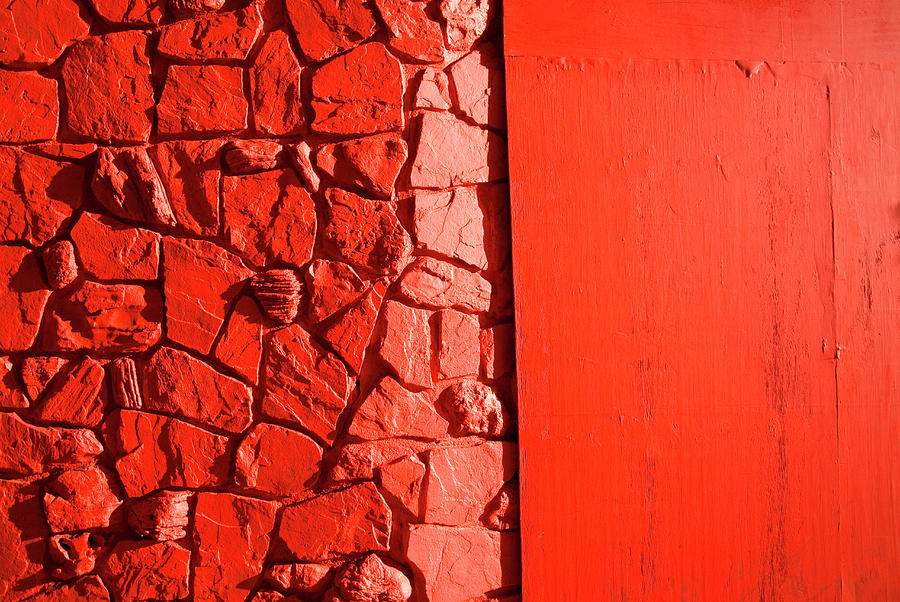 Rock And Plywood Wall Painted Red Photograph by Pete Starman
