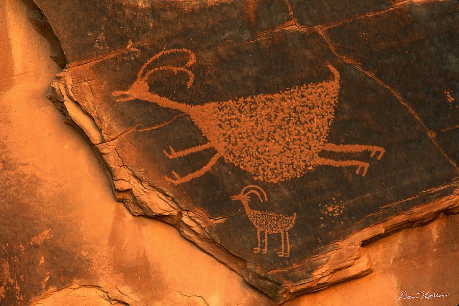 Rock art at Eye Of The Sun Arch Photograph by Dan Norris