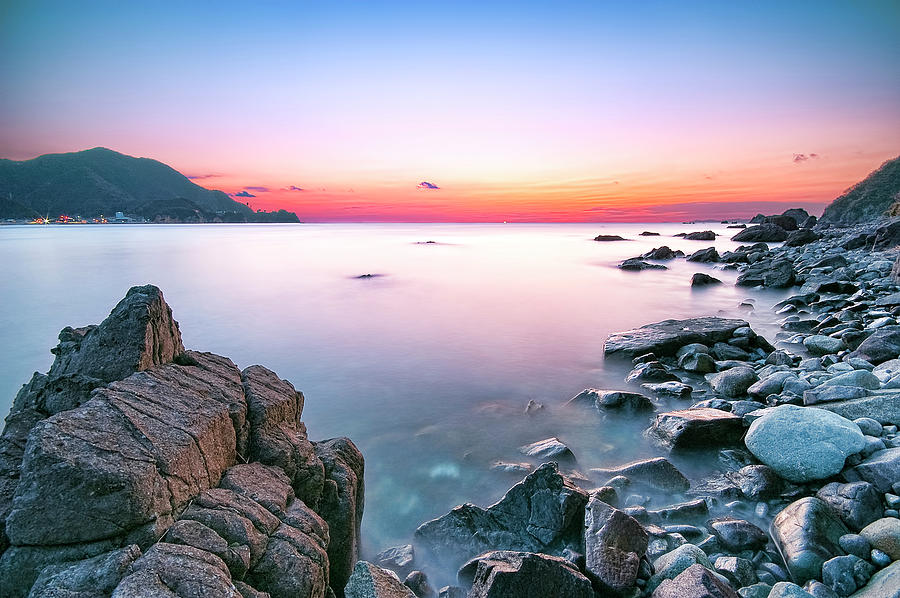 Rock Beach At Dusk Photograph by Tommy Tsutsui