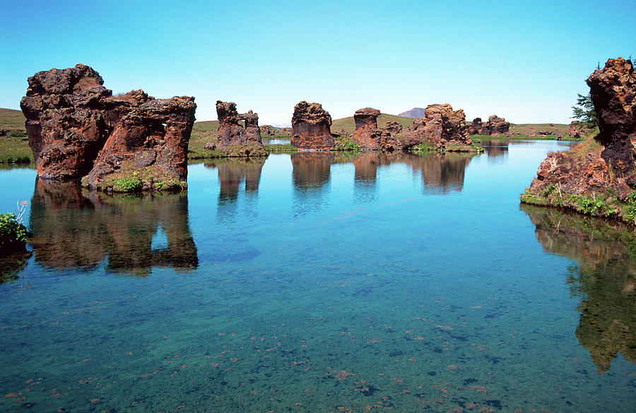 Rock Formations In Myvatn Lake Photograph by Robas