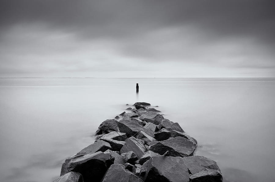 Black And White Photograph - Rock Jetty At The Chesapeake Bay by Marianne Macgregor