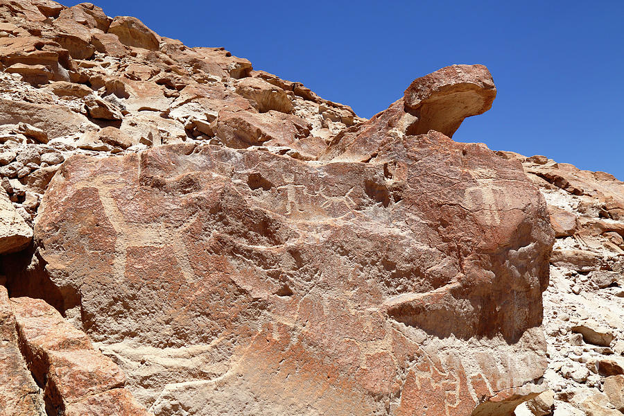 Rock with Petroglyphs at Ofragia Chile Photograph by James Brunker