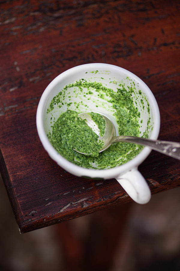 Rocket Pesto In A Cup With A Spoon Photograph by Eising Studio