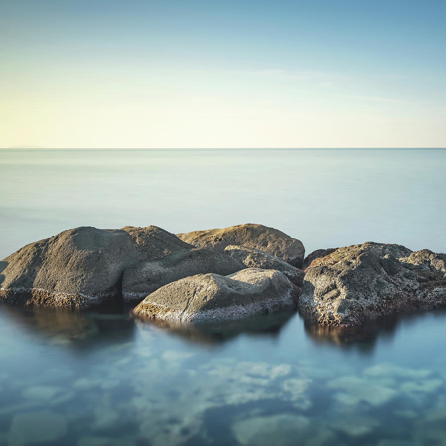 Rocks and sea in zen style.  Photograph by Stefano Orazzini