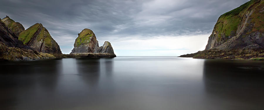 Rocks In Sea Photograph by Phillip Cullinane Photography