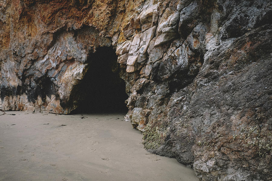 Beach Photograph - Rocky Cliff With Cave On A California Beach by Cavan Images