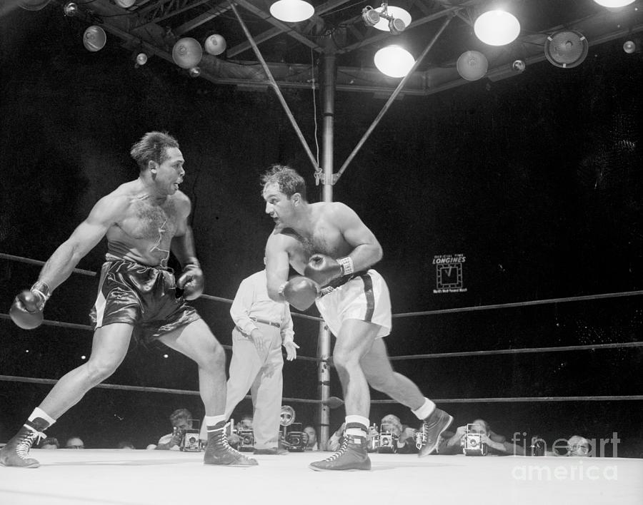 Rocky Marciano Fighting Archie Moore by Bettmann