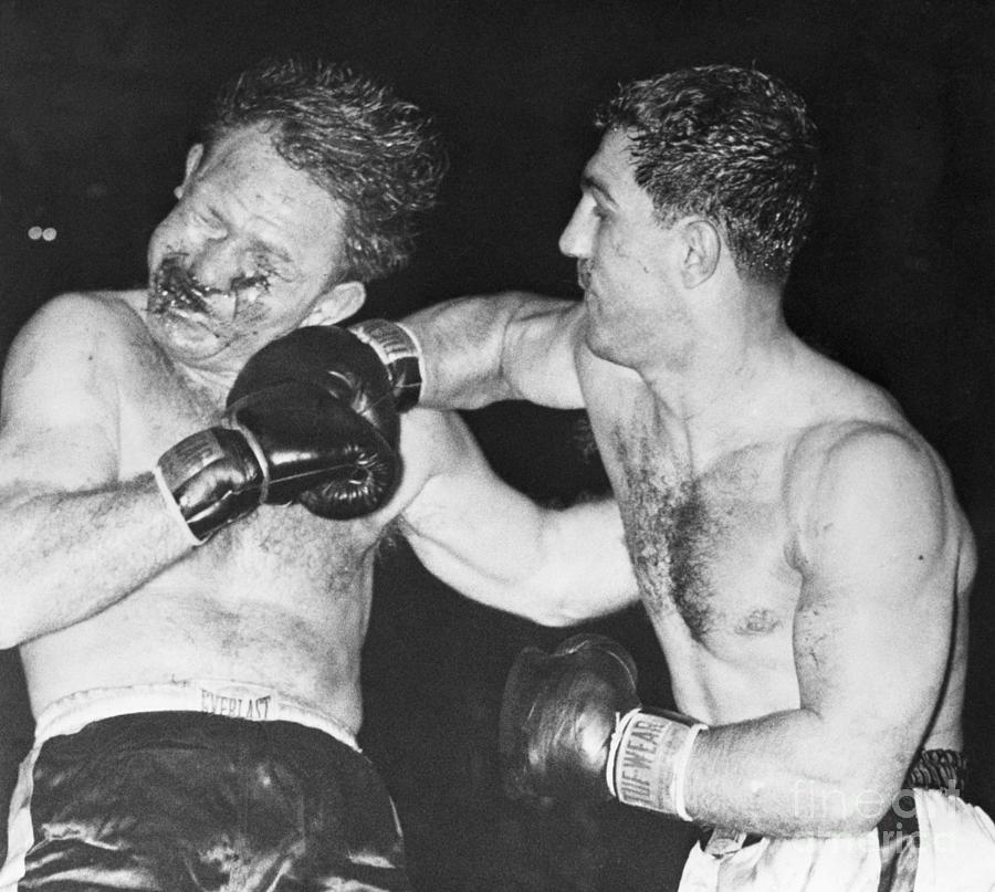Rocky Marciano Punches Bloody Lee Savold Photograph by Bettmann