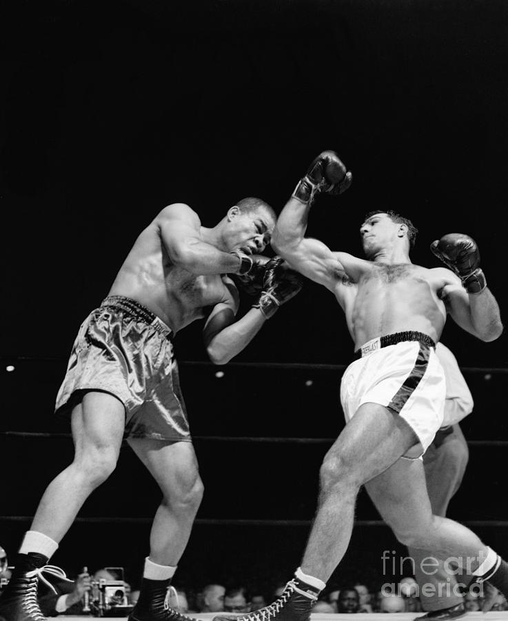 Celebrity Photograph - Rocky Marciano Punching Joe Louis by Bettmann