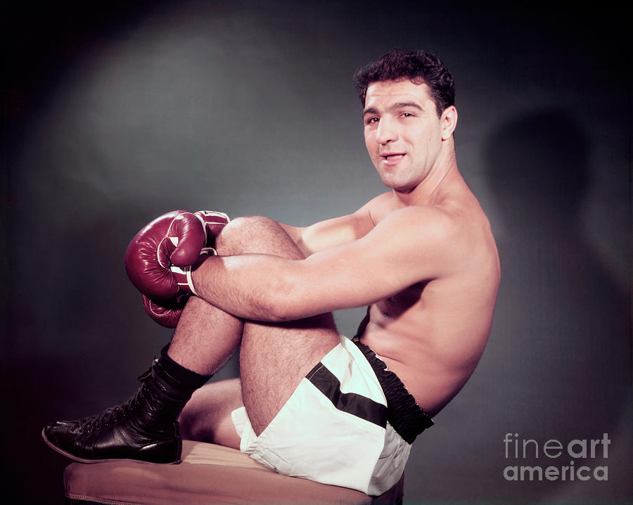 Rocky Marciano Sitting With One Knee Photograph by Bettmann