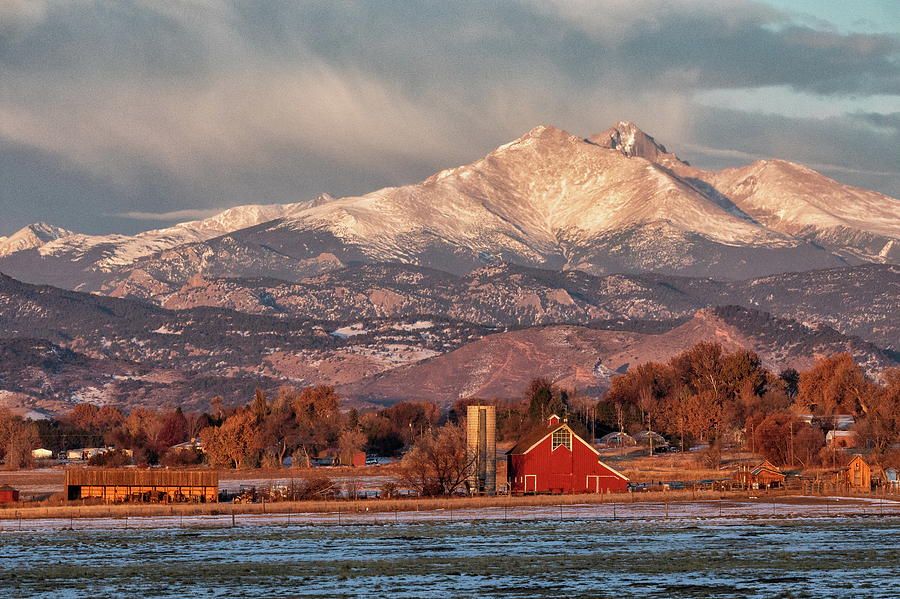 Rocky Mountains Tower Over a Farm Photograph by Tony Hake